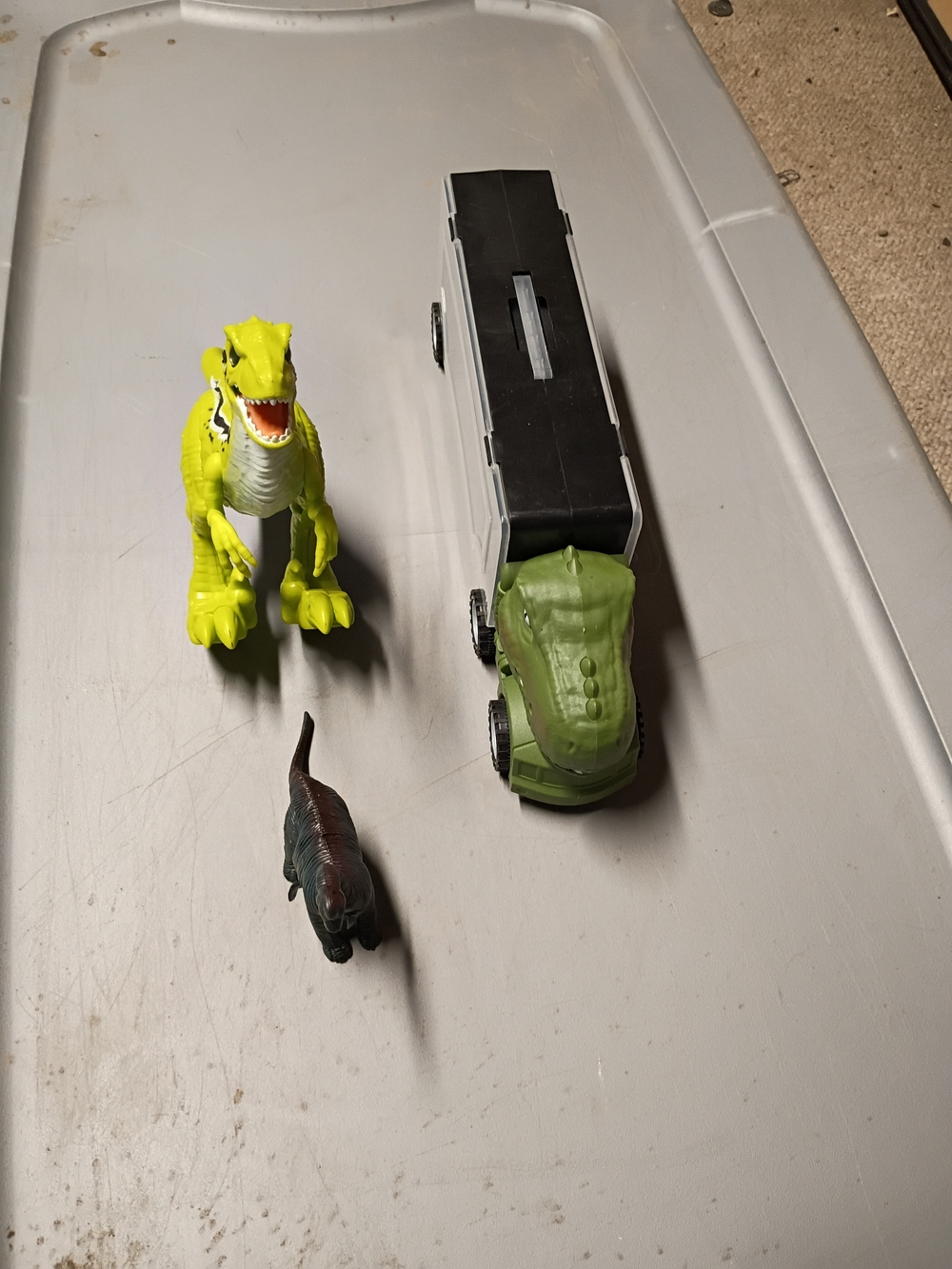 Green Dinosaur Transport Truck Toy with Yellow and Dark Green Dinosaurs